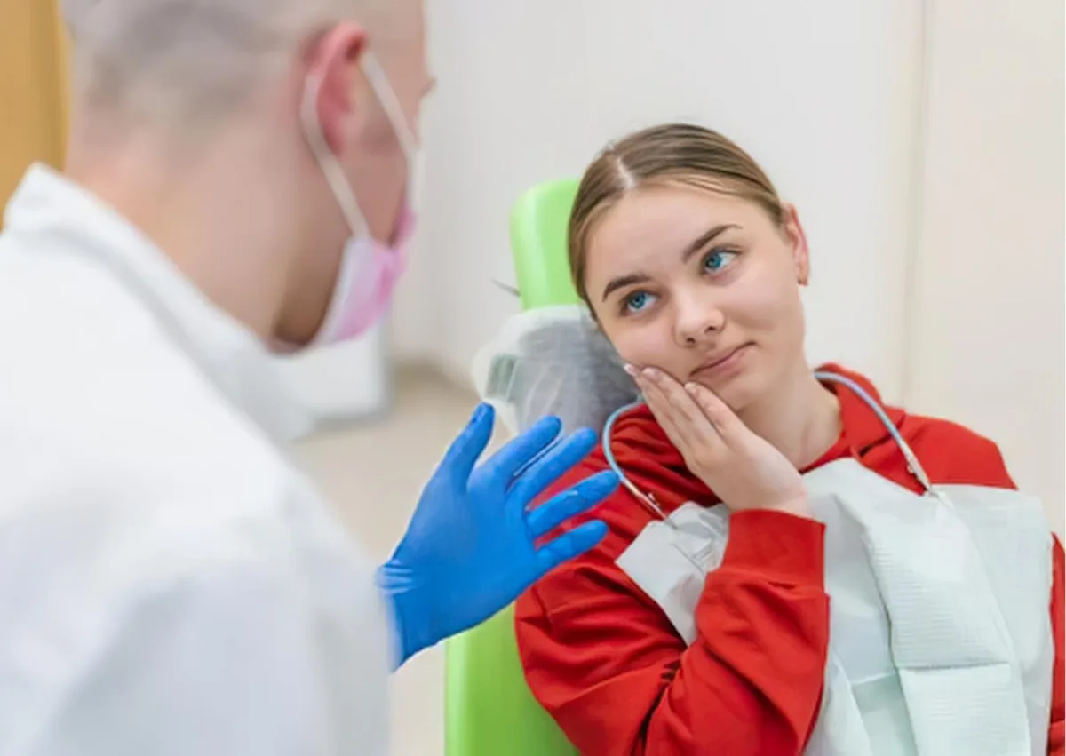 Patient discussing dietary restrictions and avoiding dairy after dental implant surgery with a dentist.